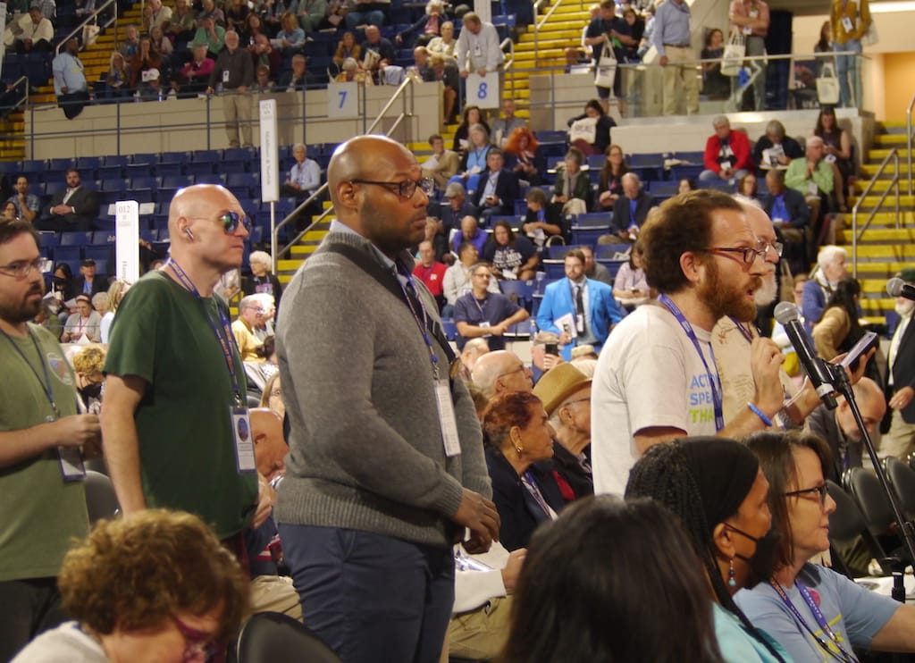 Boston Ward 4 delegate Jonathan Cohn addresses party Chairman Steve Kerrigan from the floor.