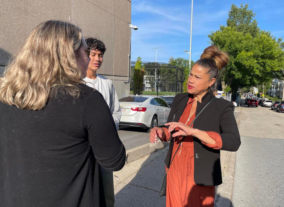 At-large Councilor Julia Mejia speaks to voters outside the Margarita Munoz school in Jamaica Plain.