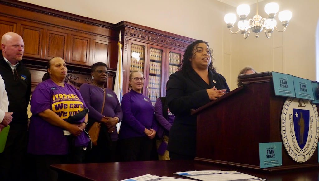 State Sen. Liz Miranda addresses activists gathered at the State House for a hearing on the Raise Up Massachusetts coalition's Corporate Fair Share bill.