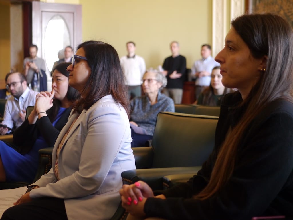 American Federation of Teachers President Jessica Tang, Framingham parent Meenakshi Agarwal and Chelsea School Committee member Sarah Neville listen during a State House briefing on education funding.