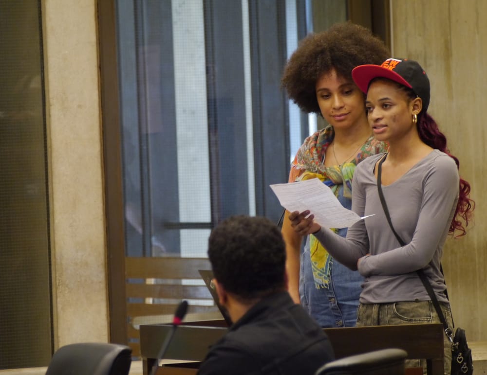 Community Academy ninth grader Adama Bah testifies before the City Council.