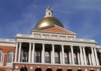 The sun reflects off the golden dome atop the Massachusetts State House