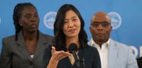 Mayor Michelle Wu, standing at a podium, addresses reporters during a Feb. 6 press conference on White Stadium.