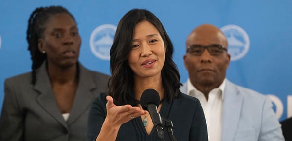 Mayor Michelle Wu, standing at a podium, addresses reporters during a Feb. 6 press conference on White Stadium.