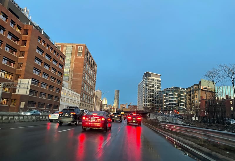 Cars travel toward downtown Boston on Interstate 90.